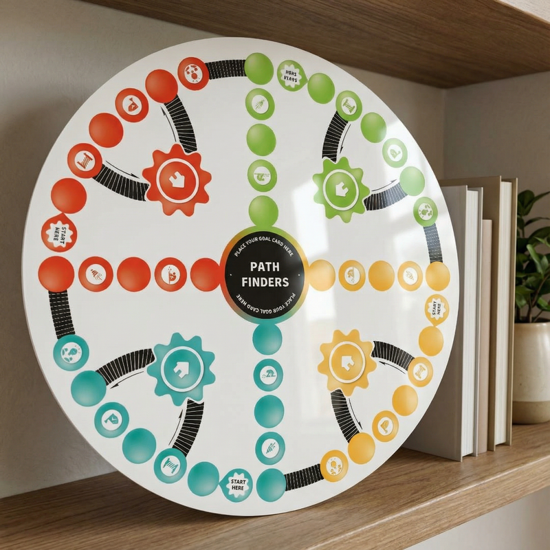 Colorful circular board game labeled 'Path Finders' on a shelf with books and a plant.
